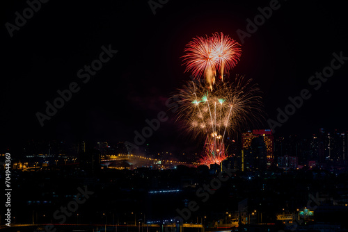 The blurred background of fireworks (light trails) is beautiful at night, seen in the New Year holidays, Christmas events, for tourists to take pictures during public travel. © bangprik
