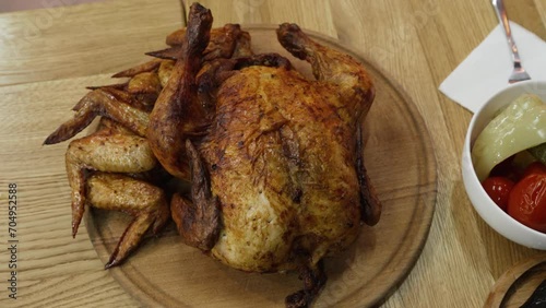 Baked chicken with wings on a wooden tray