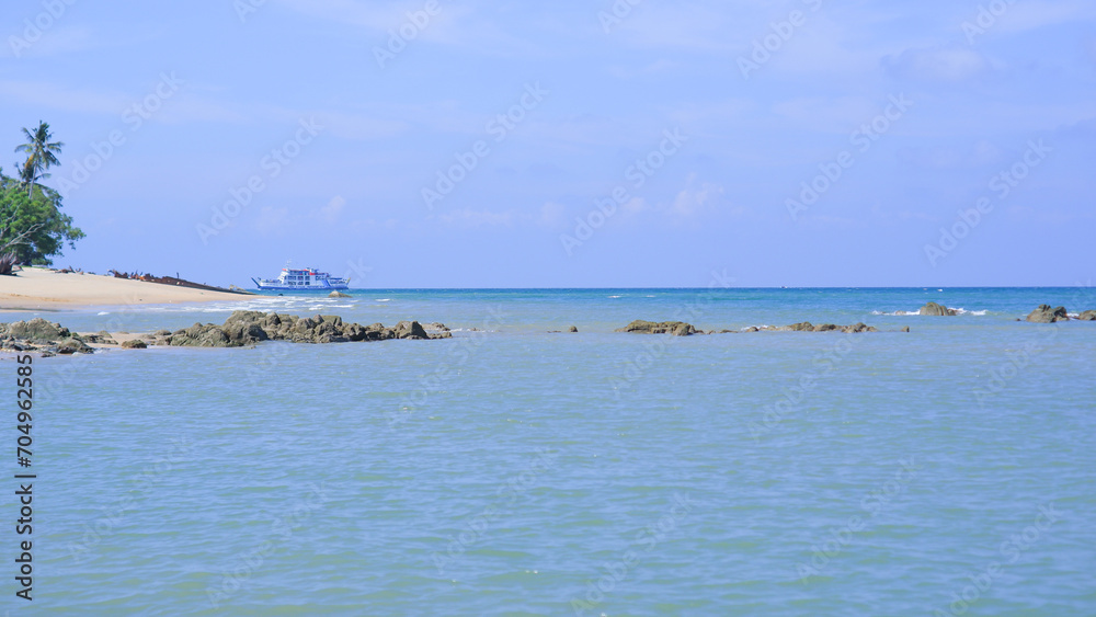 Beautiful Natural Scenery Of Blue Sea Water With Clear Skies During The Day, On Tanjung Kalian Beach, Indonesia