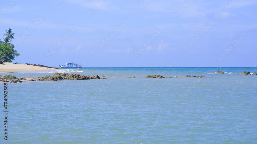 Beautiful Natural Scenery Of Blue Sea Water With Clear Skies During The Day, On Tanjung Kalian Beach, Indonesia Beautiful Natural Scenery Of Blue Sea Water With Clear Skies During The Day, On Tanjung Kalian Beach, Indonesia