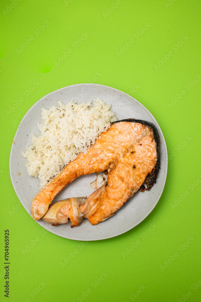 Fresh cooked delicious salmon steak with boiled rice Fresh cooked delicious salmon steak with boiled rice