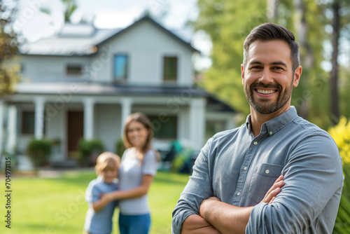 Smiling Real Estate Agent with Young Family in Front of New Home
