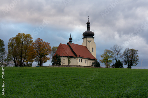 Church of Saint Clemens (kosciol sw. Klemensa) on Klimont Hill. Temple is depicted in coat of arms of the town. Ledziny, Poland. photo