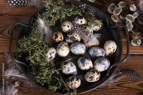 Rustic Easter, quail eggs in a ceramic bowl on the table. The Bright Easter Holiday
