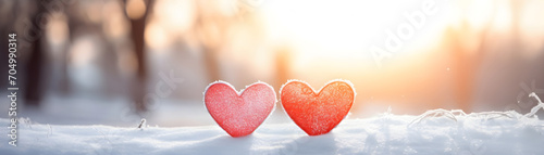 Cool hearts on the snow bikeh nature background banner for valentine day holiday photo