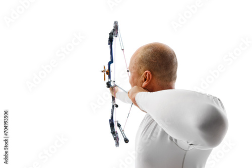 Back view image of man, archery at hele aiming with archery bow on target isolated over white studio background. Concept of professional sport and hobby, competition, action, game photo