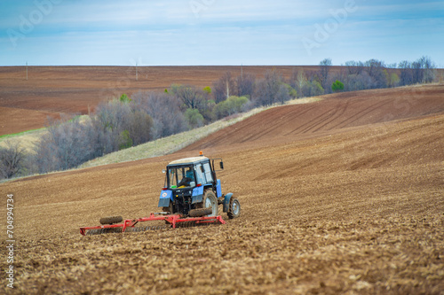 Experience the precision and skill of our little blue tractor that plows with precision. Lead the way to a bountiful harvest with our agricultural excellence. Witness skillful maneuvers