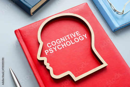 Table with a book about cognitive psychology. photo