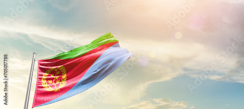 Eritrea national flag cloth fabric waving on the sky - Image