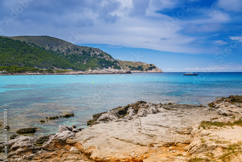 Cala Agulla beach in Mallorca with crystal-clear waters and scenic natural surroundings