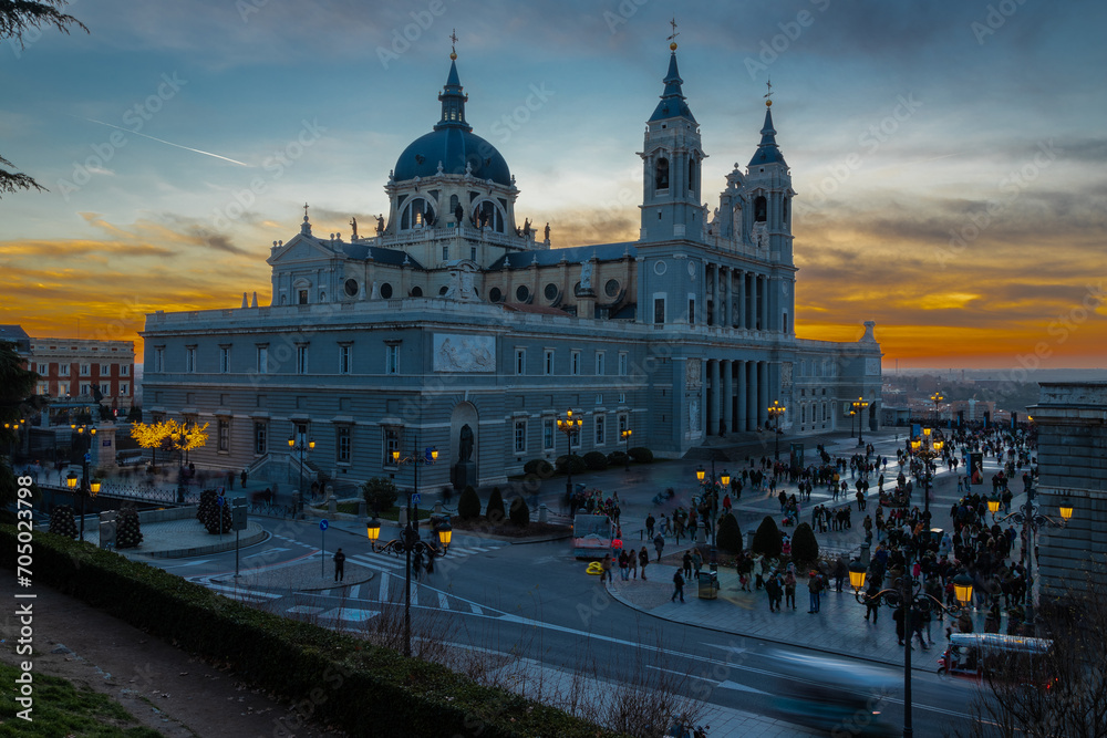 Madrid, Spain 28-12-2022 The Almudena Cathedral during a colorful sunset, it is the most important  and Catholic religious building in Madrid and a visit is free of charge except for the crypt  