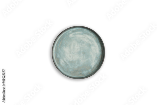 Handmade empty ceramic plate top view with copy space isolated on white background. Minimalism. Eco friendly ceramics handcraft tableware.
