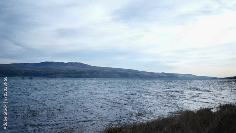 morning panorama of a lake surrounded by hills morning panorama of a lake surrounded by hills