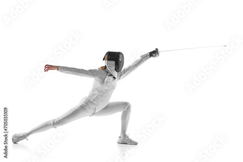 Artistry and combat. Electrifying photo of finesse of female fencer in motion, sword gleaming, against white studio background. Concept of professional sport, active lifestyle, fitness, strength.