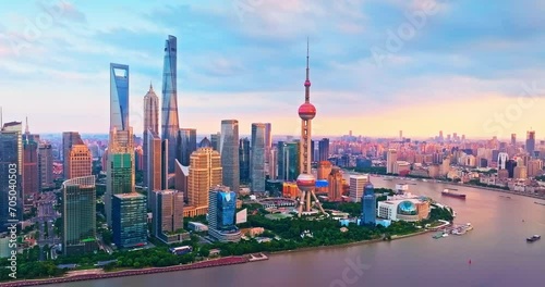 Aerial forward shot of Shanghai downtown buildings skyline at sunrise