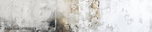 A weathered white concrete wall with paint peeling and streaks, suitable for background texture or urban decay themes.