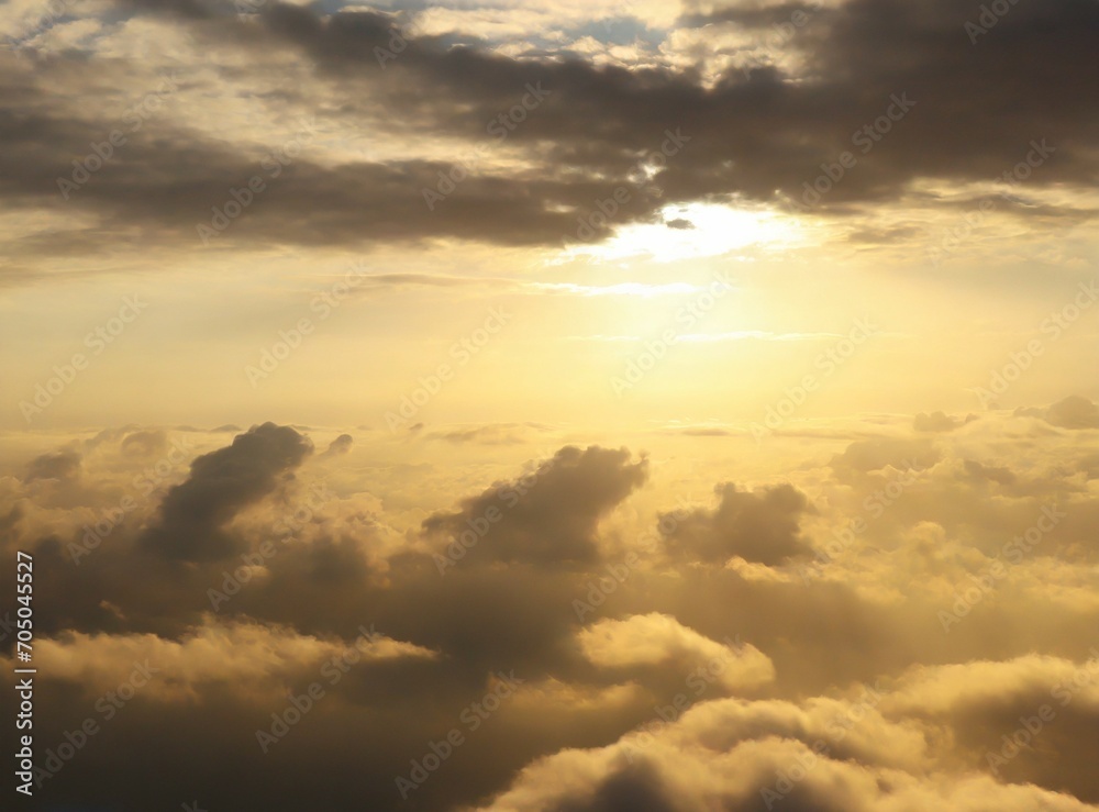 View of sunrise on the sky through the clouds