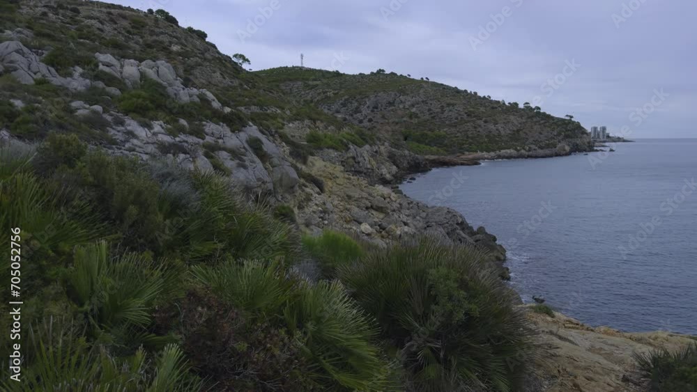 Walk through the hills on Spain's Mediterranean coast. Narrow paths with stones high above sea level. A popular place for active recreation among tourists and citizens. Walk through the hills on Spain's Mediterranean coast. Narrow paths with stones high above sea level. A popular place for active recreation among tourists and citizens.