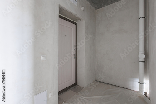 interior of the apartment without decoration in gray colors. rough finish