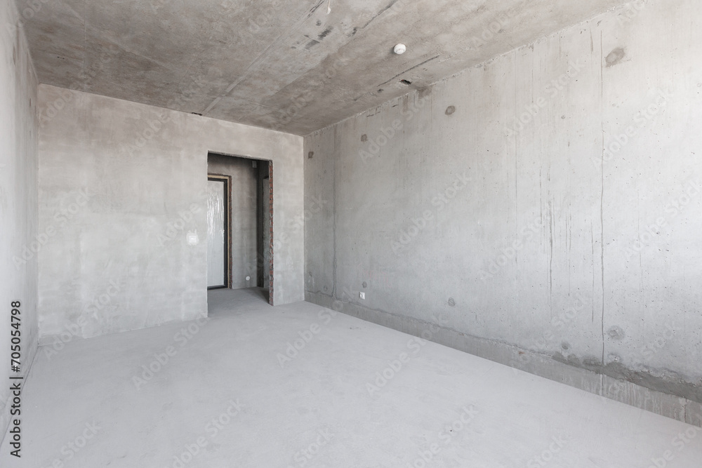 interior of the apartment without decoration in gray colors. rough finish