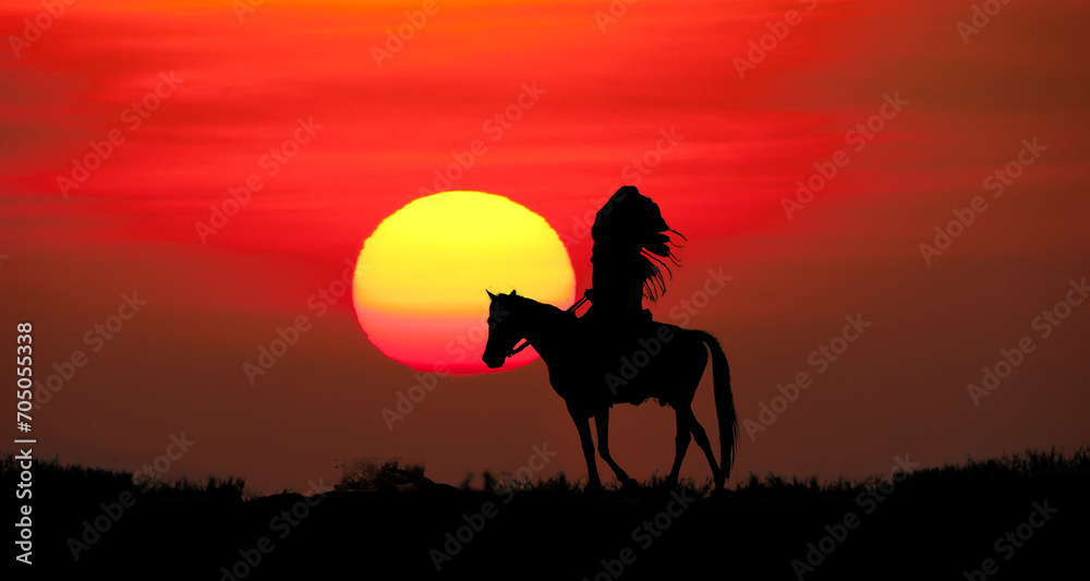 silhouette of indians man riding a horse on sunset background