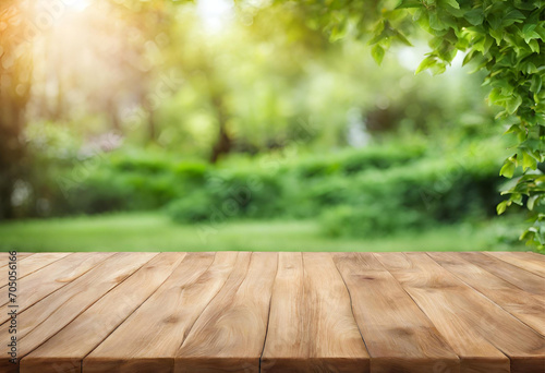 Wooden table surface with a vibrant green garden background, excellent for presentations, v2 © Produzir