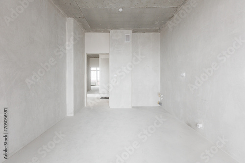 interior of the apartment without decoration in gray colors. rough finish