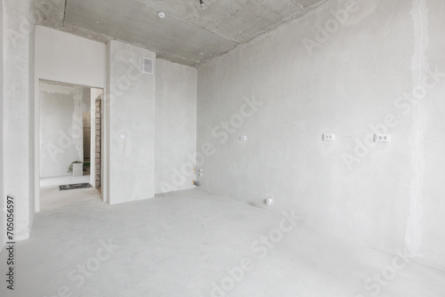 interior of the apartment without decoration in gray colors. rough finish