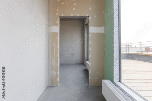 interior of the apartment without decoration in gray colors. rough finish