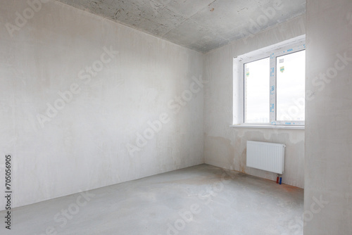 interior of the apartment without decoration in gray colors. rough finish