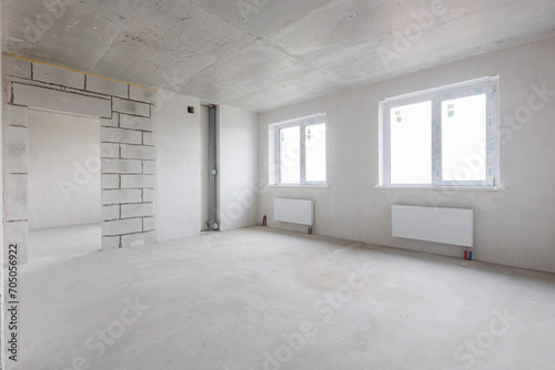 interior of the apartment without decoration in gray colors. rough finish