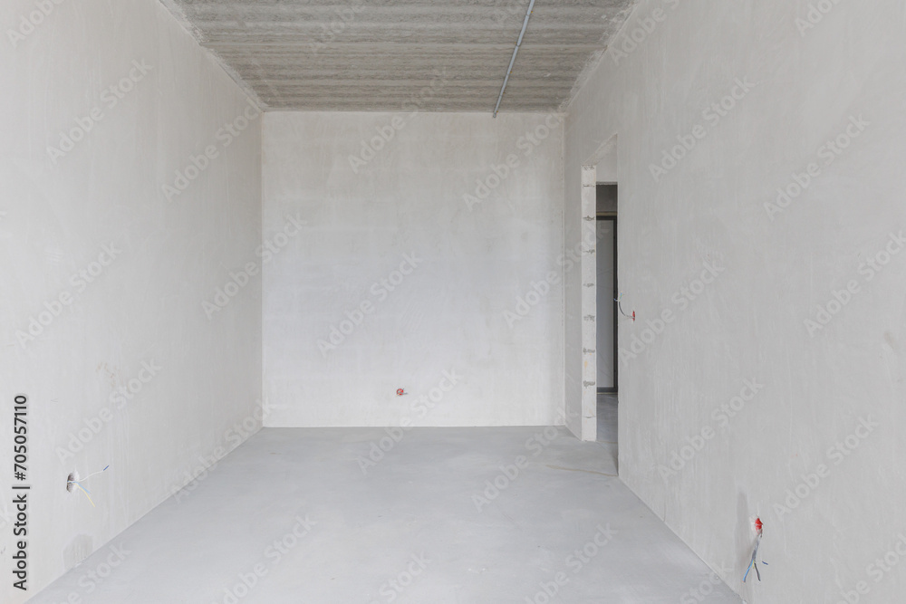 interior of the apartment without decoration in gray colors. rough finish interior of the apartment without decoration in gray colors. rough finish