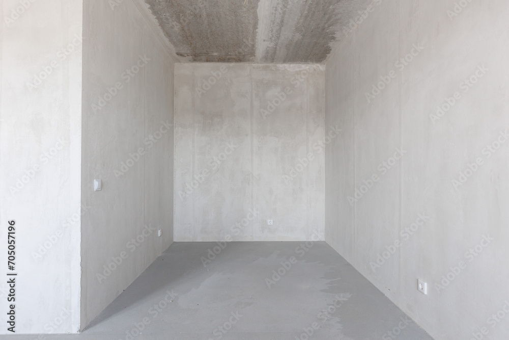 interior of the apartment without decoration in gray colors. rough finish interior of the apartment without decoration in gray colors. rough finish