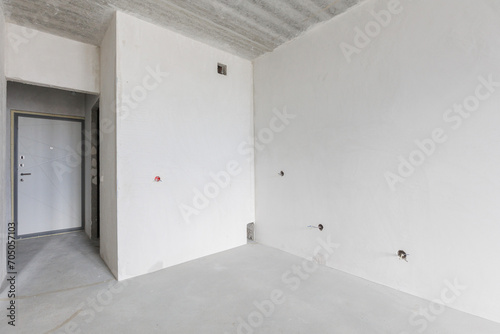 interior of the apartment without decoration in gray colors. rough finish