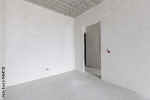 interior of the apartment without decoration in gray colors. rough finish