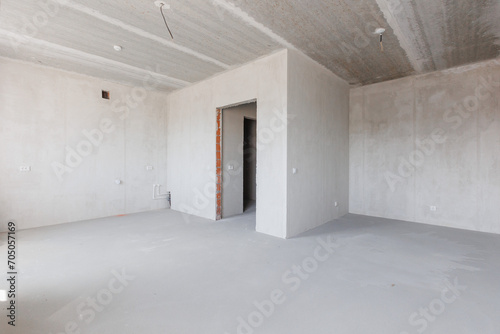 interior of the apartment without decoration in gray colors. rough finish
