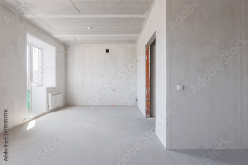 interior of the apartment without decoration in gray colors. rough finish