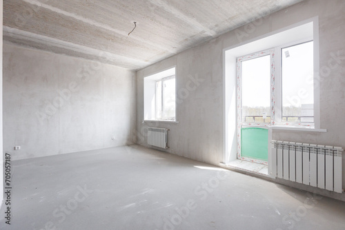 interior of the apartment without decoration in gray colors. rough finish