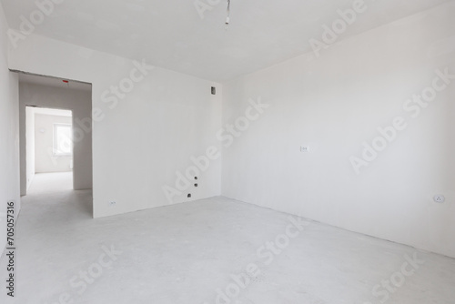 interior of the apartment without decoration in gray colors. rough finish