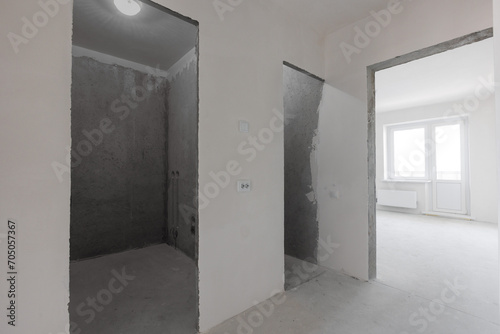 interior of the apartment without decoration in gray colors. rough finish