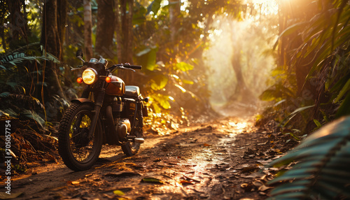 Motorcycle on the road in the forest at sunset. Travel and adventure concept.