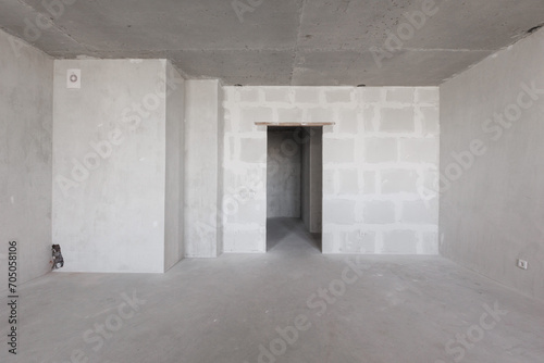 interior of the apartment without decoration in gray colors. rough finish