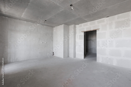 interior of the apartment without decoration in gray colors. rough finish