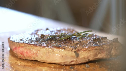 Close up spicing cooked beef steak 4k photo