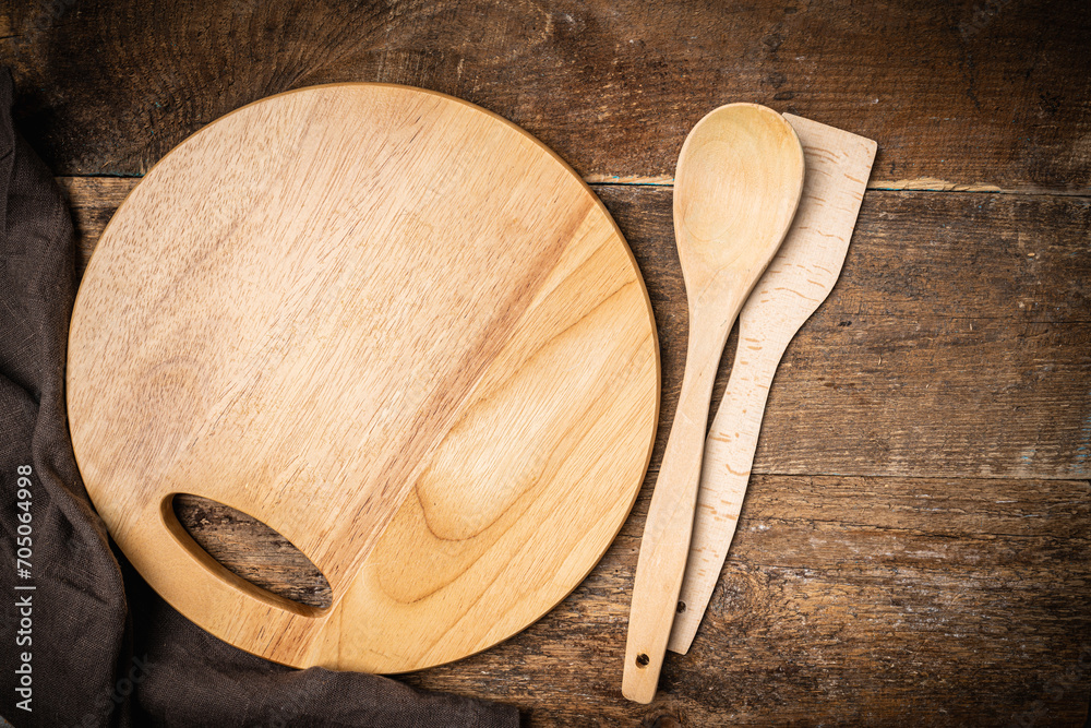 Old wooden kitchen utensils or cooking tools and bowls on wooden background, top view, flat lay. Kitchenware collection with copy space. Cooking background. Old wooden kitchen utensils or cooking tools and bowls on wooden background, top view, flat lay. Kitchenware collection with copy space. Cooking background.