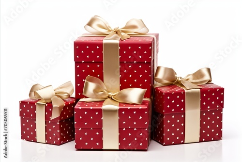 assorted red and white gift wrapped presents with red and gold ribbon bows on white background