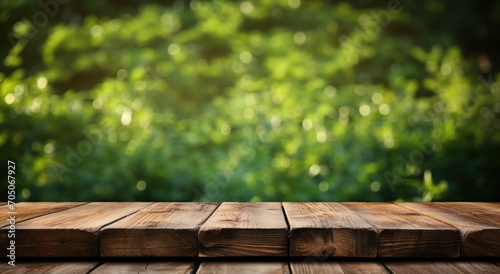Nature landscape background Wooden table background with green bokeh. Empty table for product display montage