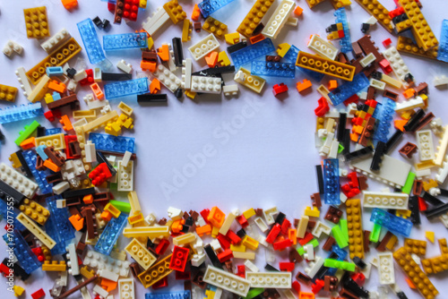 pile of colorful Lego blocks with place for content or text. Top angle view of lego bricks on white background. copy space