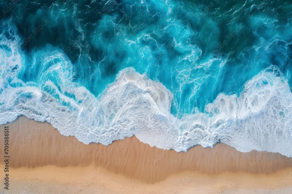 Aerial view of ocean waves crashing onto a sandy shore. Aerial view of ocean waves crashing onto a sandy shore.