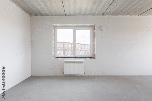 interior of the apartment without decoration in gray colors. rough finish